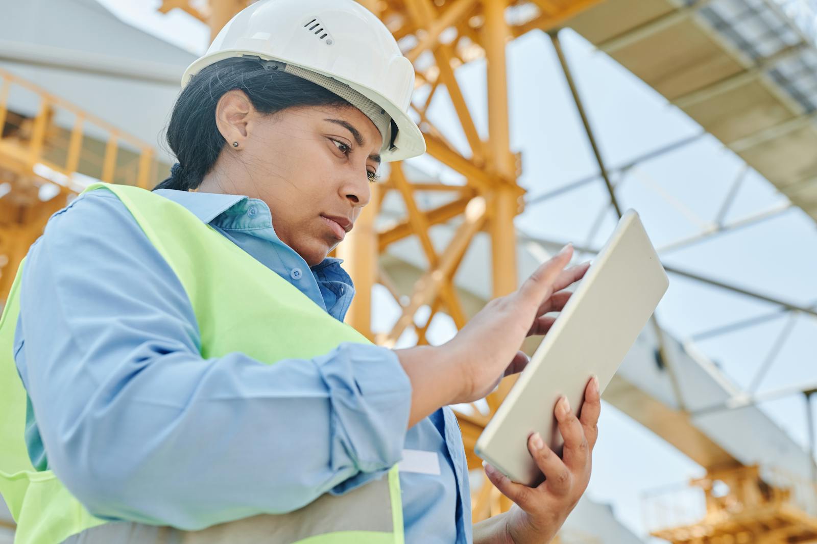 Engineer using a tablet on a construction site