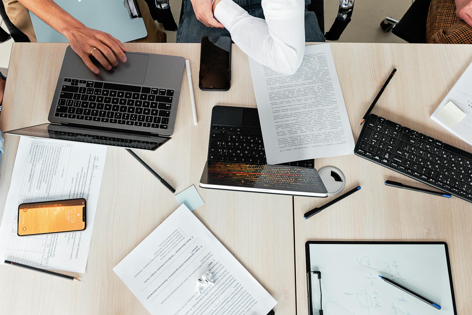 Office desk with documents and laptops